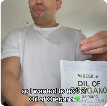 Man holding a container labeled 'Oil of Oregano' with text overlay.