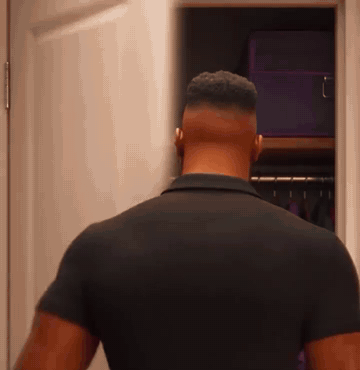 He pulls an old polo shirt from the back of his closet