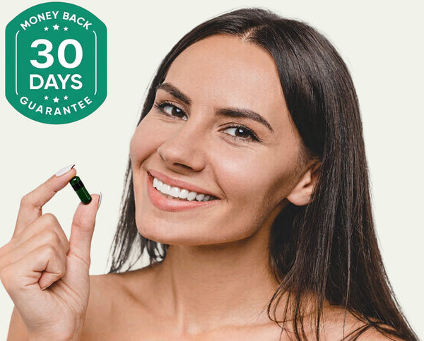 Smiling woman holding softgel