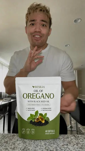 Resilia customer holding the Oil of Oregano pouch