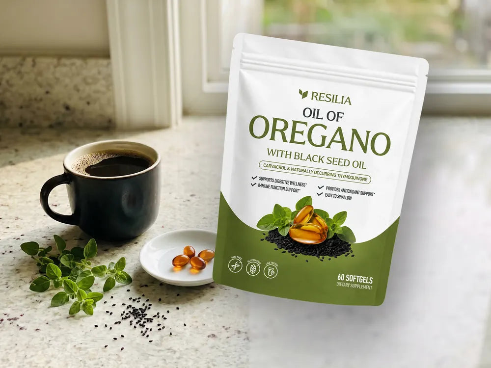 The Resilia Oil of Oregano with Black Seed Oil pouch above a morning kitchen counter with coffee, softgels, oregano sprigs and black seeds