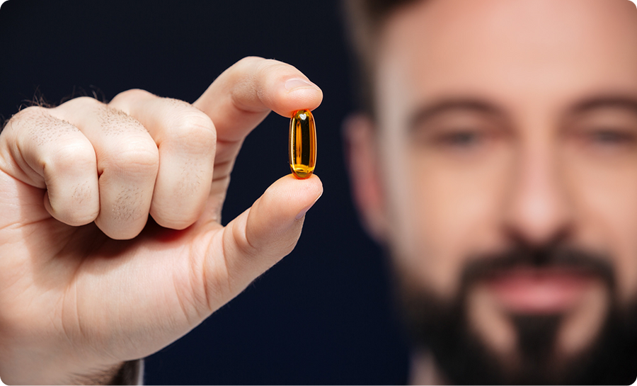Man holding capsule