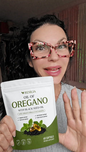 Resilia customer holding the Oil of Oregano pouch