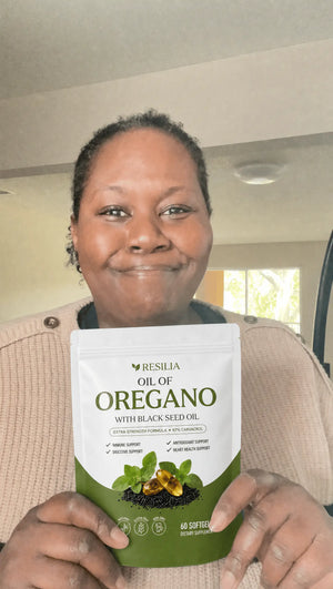 Resilia customer holding the Oil of Oregano pouch