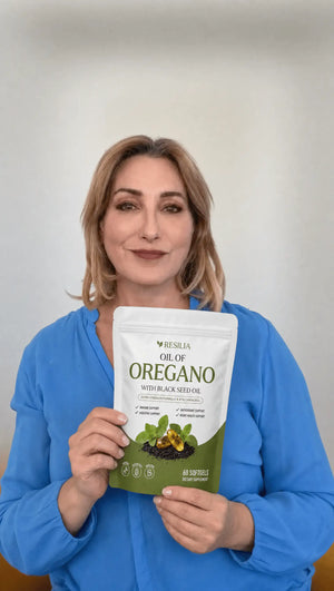 Resilia customer holding the Oil of Oregano pouch